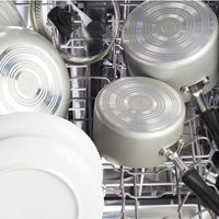 Pots and dishes arranged inside a dishwasher.