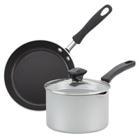 A frying pan and a saucepan with a glass lid, both with black handles.