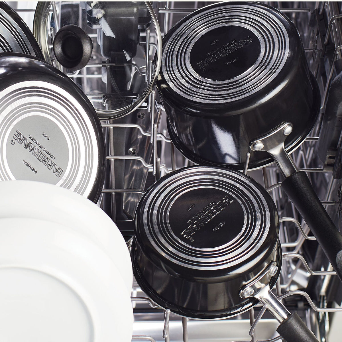 Pots and dishes arranged inside a dishwasher.