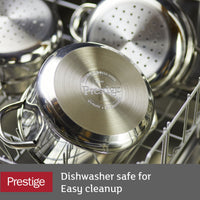 Stainless steel pots in a dishwasher, labeled "Prestige.