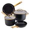 A 6 Piece Cookware Set in black and gold arranged together.