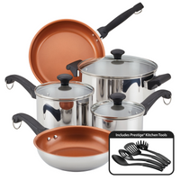 Cookware set with pots, pans, glass lids, and black kitchen utensils.