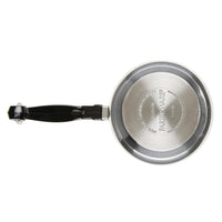 Stainless steel saucepan with a black handle viewed from above.