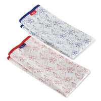 Part of our Bon Voyage collection, these two folded kitchen towels feature charming red and blue floral patterns on a crisp white background. Perfect for adding a touch of elegance to your daily essentials.