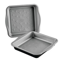 Two gray Disney 9" cake pans with Mickey Mouse patterns inside.