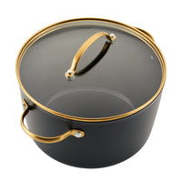 This stylish pot from the Forged Induction Ceramic 12-Piece Cookware Set is crafted from forged aluminum and features gold handles along with a glass lid.