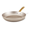 The Radiant Nonstick Frying Pan, showcasing a champagne-colored surface and a golden handle, is elegantly presented against a white background. Its design guarantees even heat distribution, combining functionality with style in any kitchen environment.