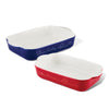 A set of two ceramic baking dishes in blue and red, featuring decorative writing and inspired by the Disney Mickey Mouse Bon Voyage collection.