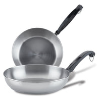 Two stainless steel frying pans with black handles on a white background.
