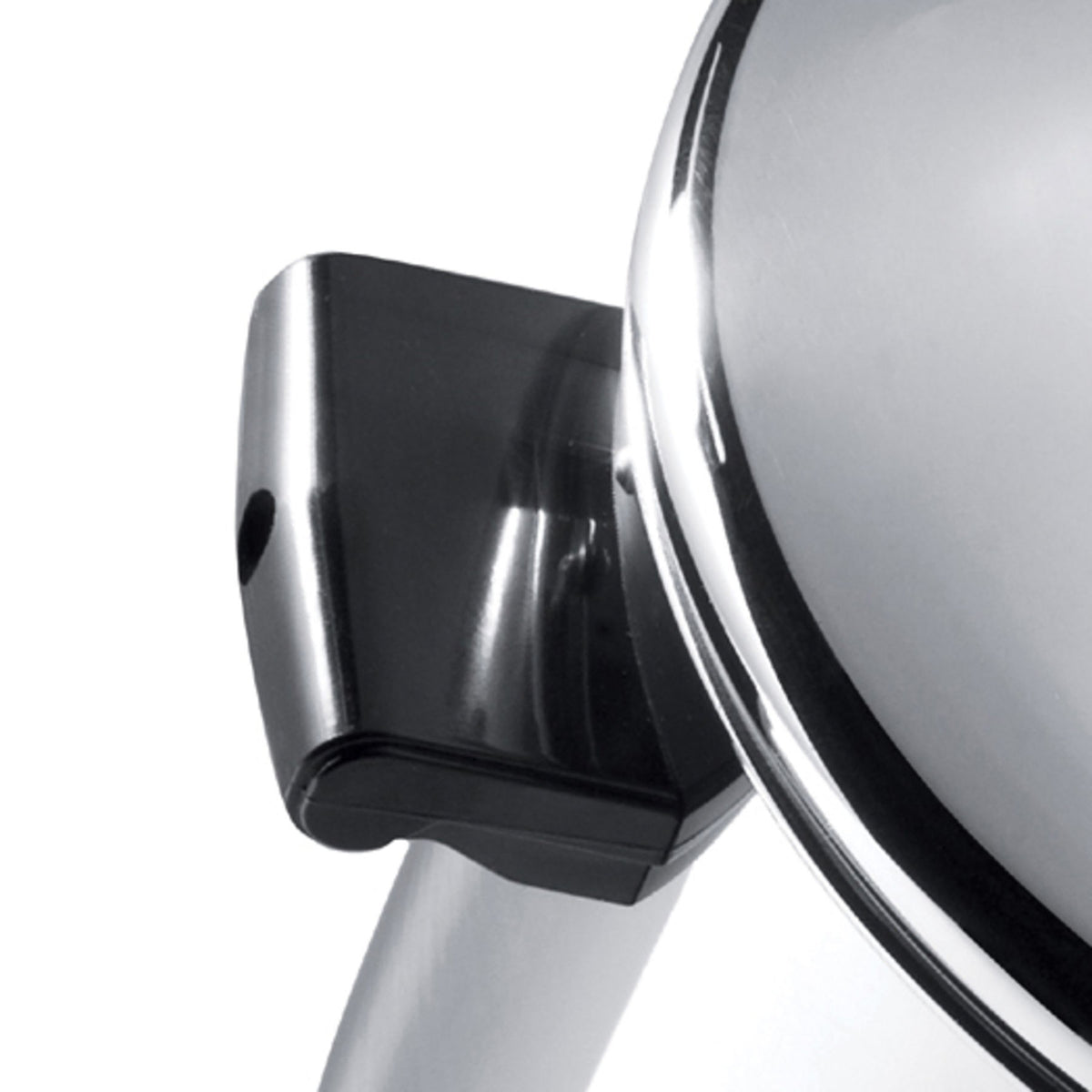 Close-up of a shiny, stainless steel pot with a black plastic handle.