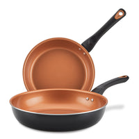A set of two 9.25-inch and 11.25-inch copper ceramic nonstick frying pans with black handles are stacked together, offering a superior nonstick experience with CopperSlide technology.