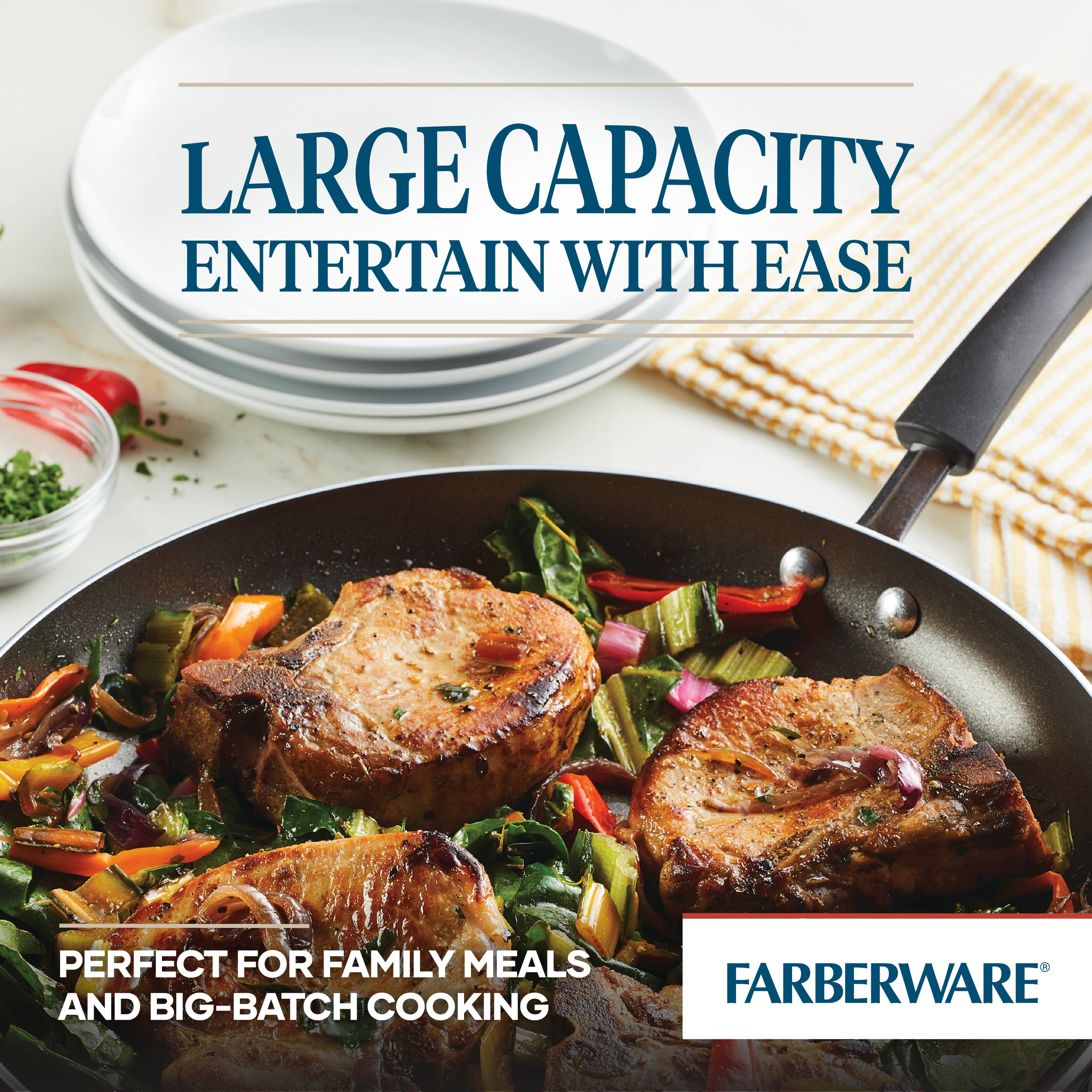 A 14-Inch Nonstick Frying Pan with Helper Handle, featuring cooked pork chops and vegetables, elegantly sits on the table, highlighting its dishwasher-safe convenience for effortless cleanup.