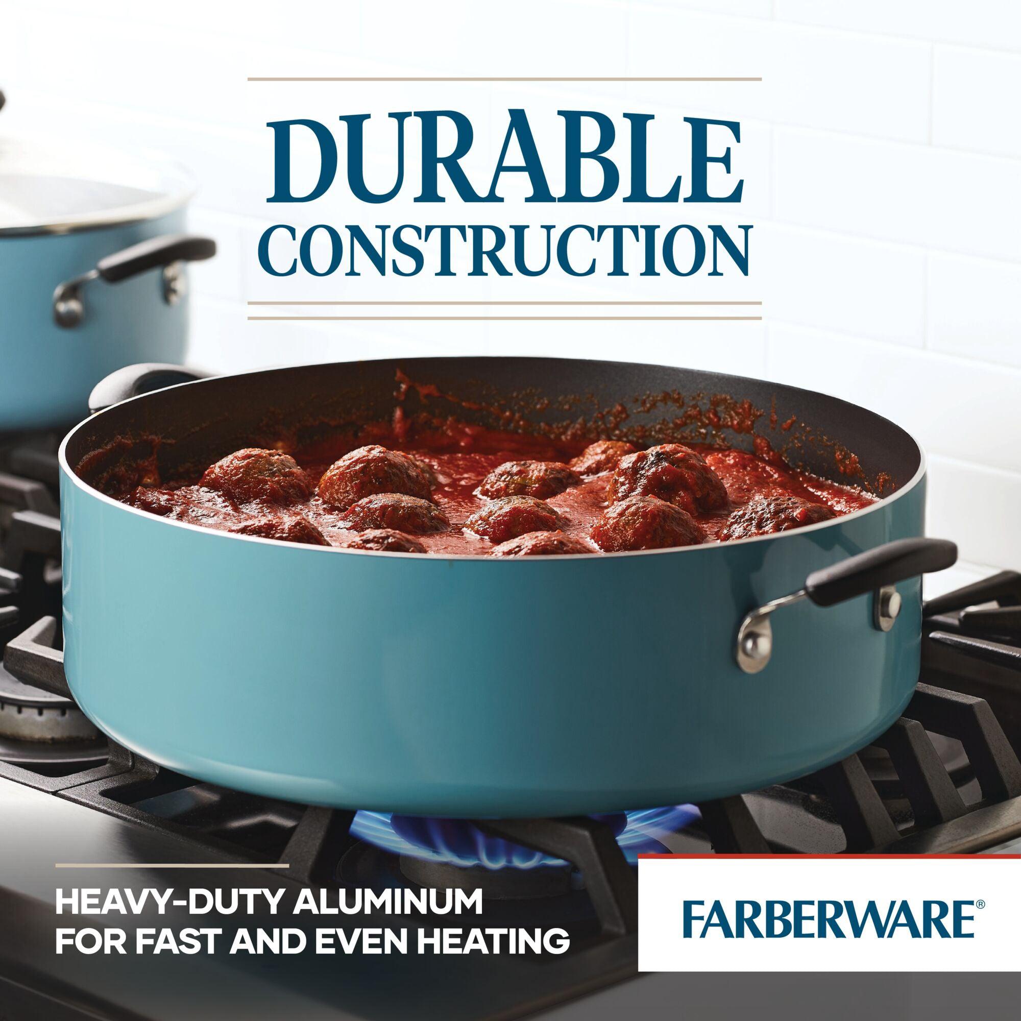 A 14-Inch Nonstick Family Pan by Farberware on the stove, cooking meatballs and tomato sauce, perfect for preparing large portions of family recipes.
