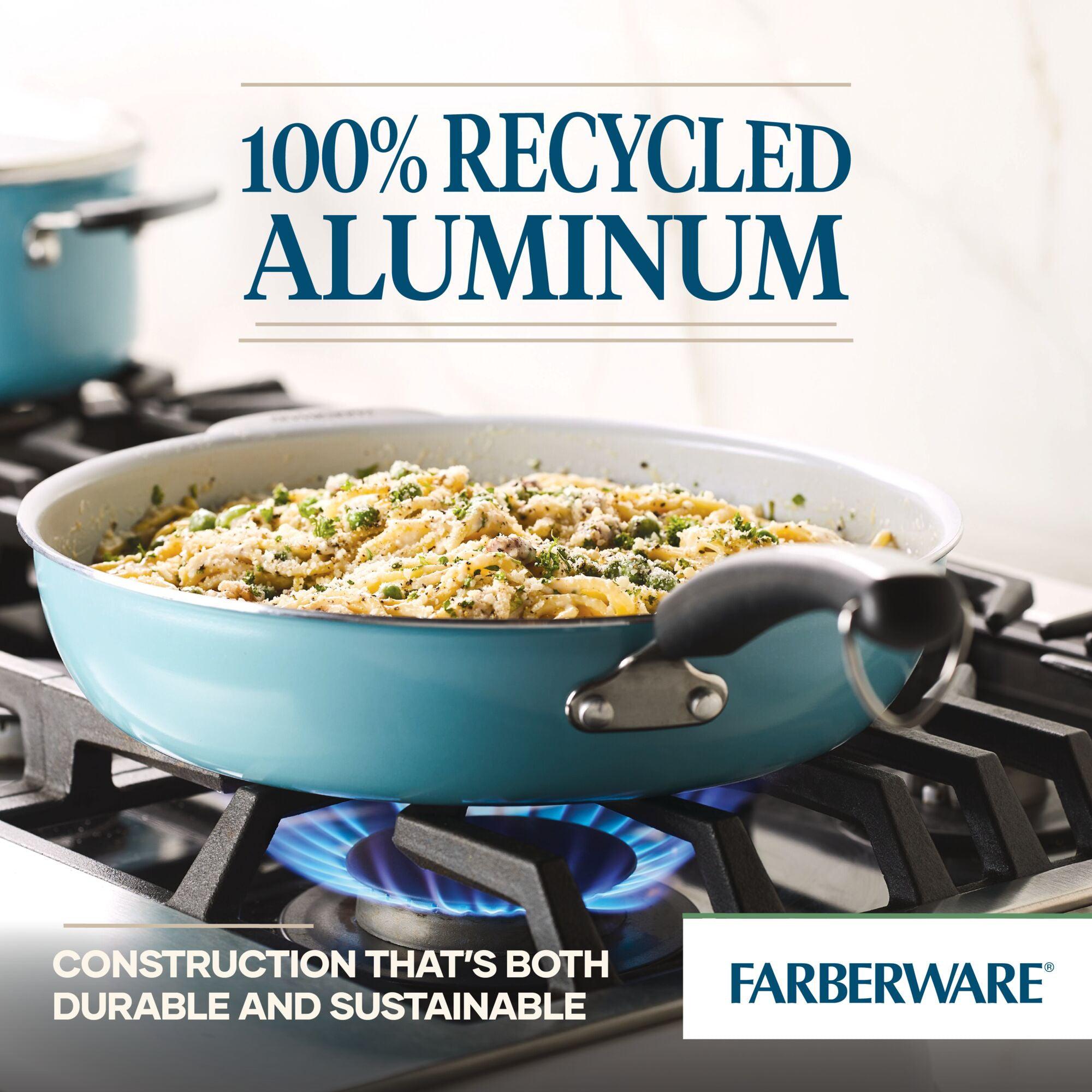 A 12.5-Inch Recycled Aluminum Ceramic Nonstick Deep Frying Pan sizzles on a gas stove, crafted from 100% recycled aluminum. Its ceramic nonstick surface promotes healthy cooking by minimizing the need for oil, making each meal both eco-friendly and flavorful.
