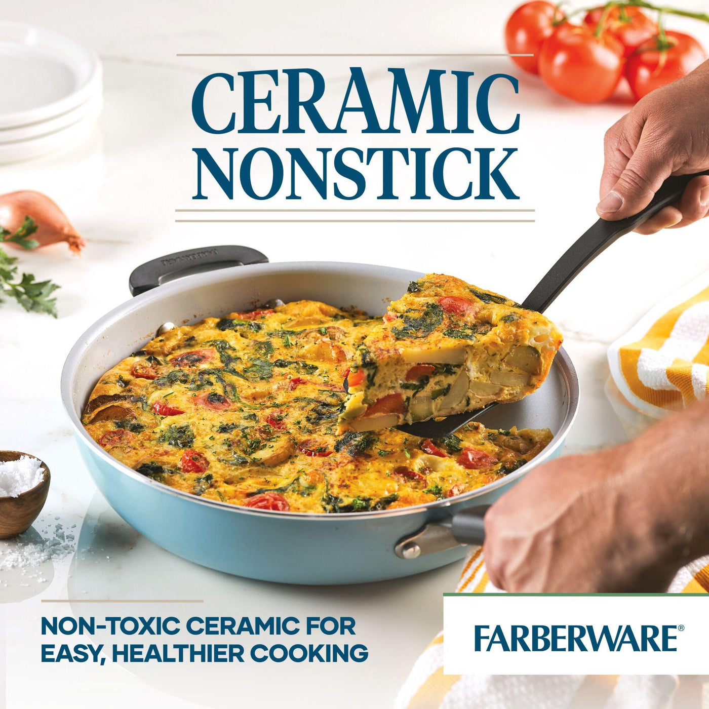 Hands holding a 12.5-inch recycled aluminum ceramic nonstick deep frying pan with a vegetable frittata, ideal for healthy cooking.