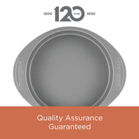 This round gray piece from the 4-Piece Nonstick Cookie Pan and Cake Pan Set comes with embossed handles and includes a "Quality Assurance" guarantee. It's oven-safe and nonstick, making it perfect for all your baking needs.