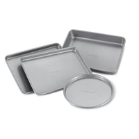 The 4-Piece Toaster Oven Pan Set includes expertly designed nonstick pans, featuring three gray rectangular pans and one round pan, ideal for small batch baking and perfect for enhancing your culinary creations.