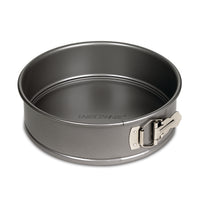 The 9-Inch Round Springform Pan features a convenient latch on the side, making it perfect for baking. Its nonstick surface ensures easy release and clean-up.