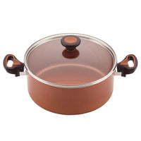 The 12-Piece Copper Ceramic Nonstick Cookware Set features a copper-colored cooking pot equipped with CopperSlide technology, complemented by a sleek glass lid and black handles, making it both nonstick and dishwasher safe.