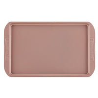 Cookie Pan in a rectangular shape, featuring a rose gold color with a nonstick surface and side handles, ideal for baking cookies.