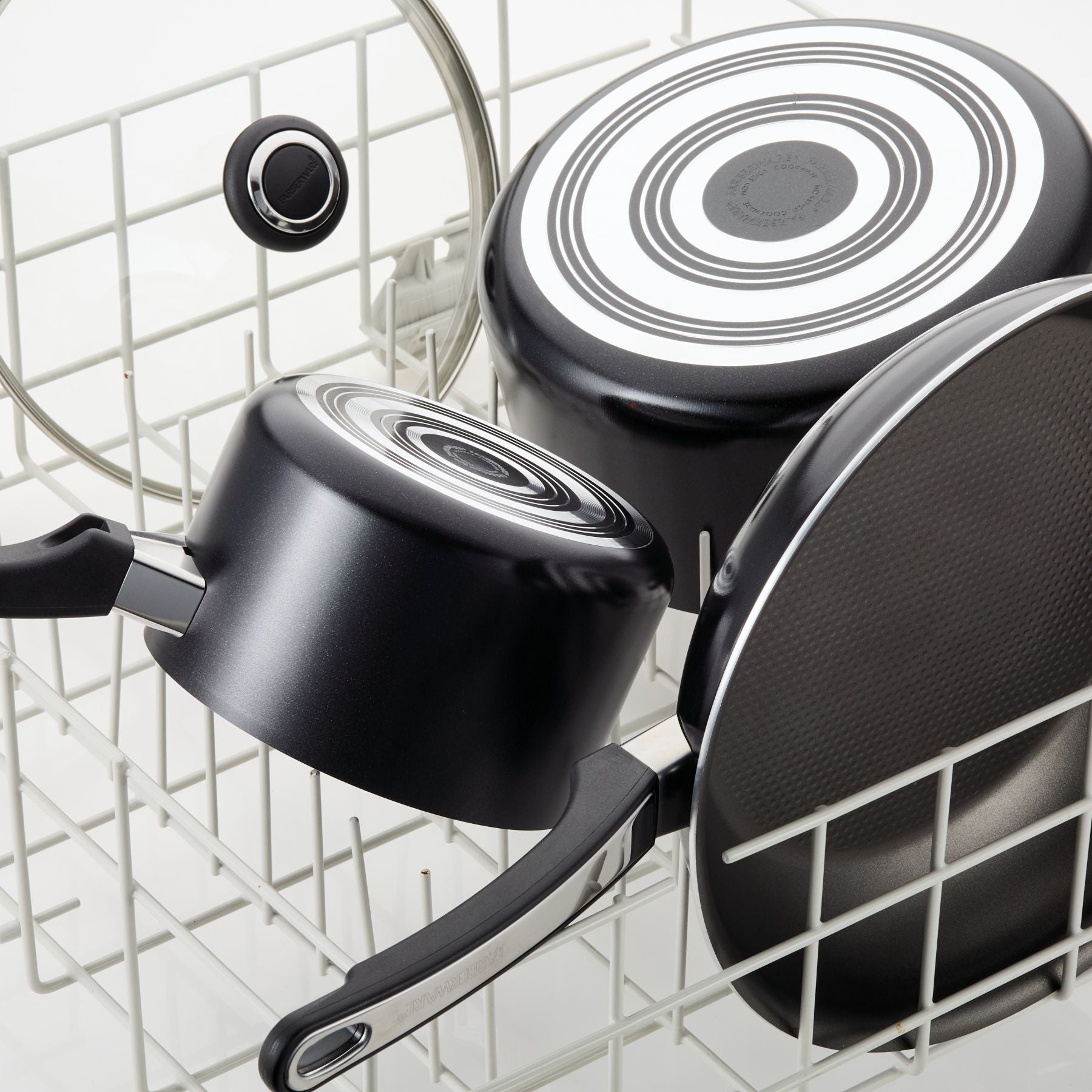 The 11-Inch Nonstick Square Griddle, in black, is neatly arranged in a white dish rack.