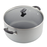 10.5-Quart Nonstick Stockpot featuring a glass lid and black handles, ideal for cooking family-sized portions. It's also dishwasher safe for easy cleanup.