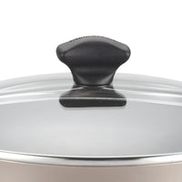 Close-up of a pot lid handle on a transparent glass lid, ideal for the 6-Quart Nonstick Jumbo Cooker.