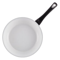 Top view of a frying pan from the high-performance, 12-Piece Nonstick Cookware Set featuring a sleek black handle.