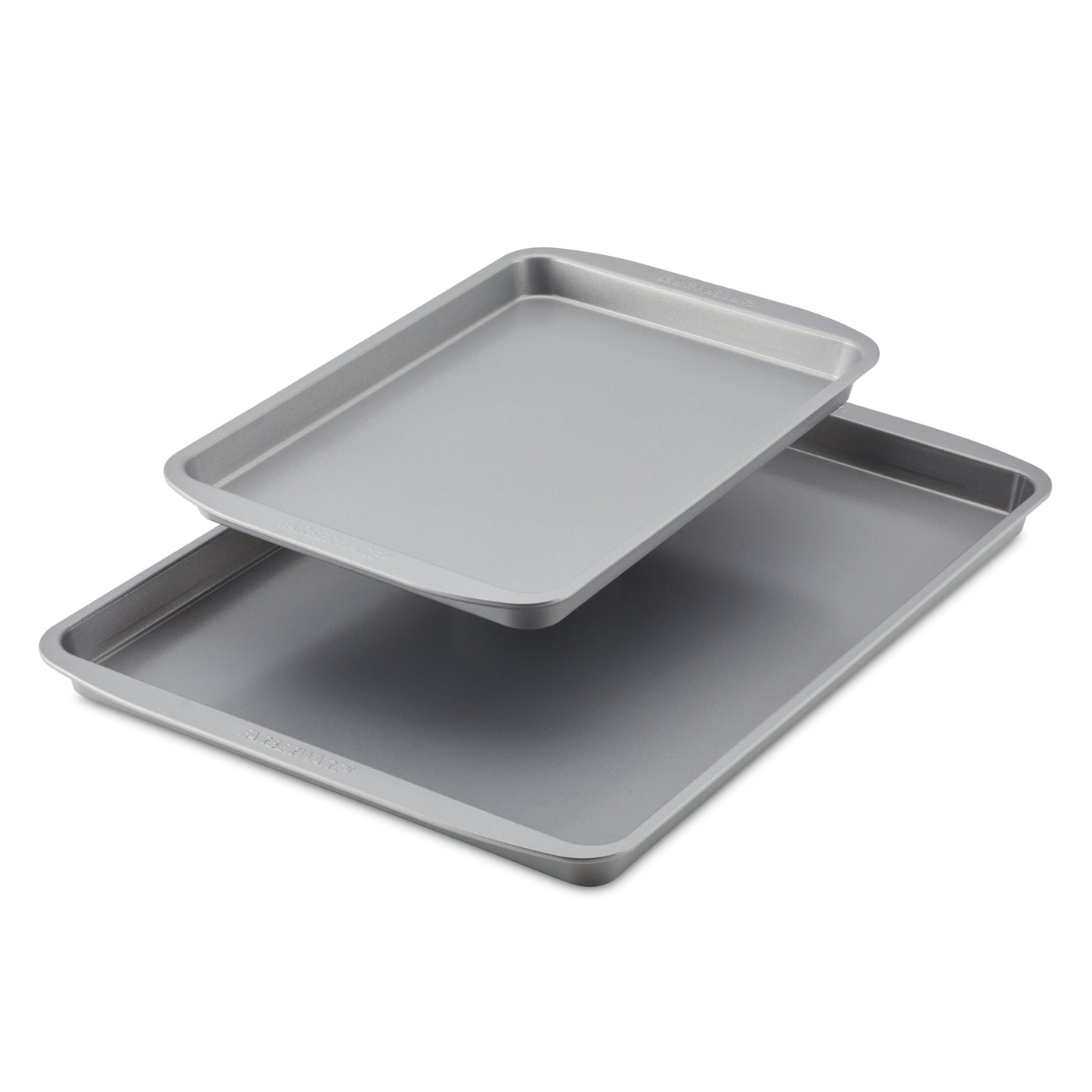 A 2-Piece Nonstick Sheet Pan Set, featuring two stacked heavy-gauge steel baking trays in gray, on a white background.